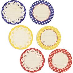 four paper plates with different designs and patterns on the top one has a name tag