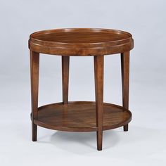 a round wooden table with two shelves on each side and one shelf at the top