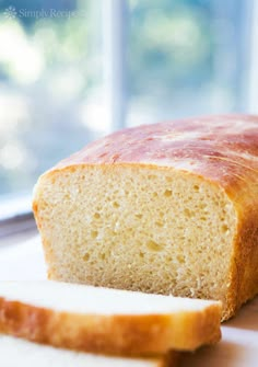 a loaf of bread sitting on top of a cutting board