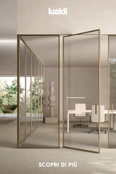 an office with glass walls and white chairs