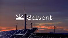 solar panels and windmills with the word solvent over them in front of a sunset