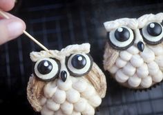 an image of two owls made out of food with eyes painted on the top and one has a toothpick in it's mouth