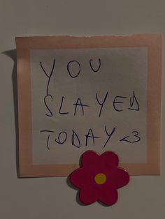 a piece of paper with the words you slayed today written on it and a flower