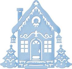 a paper cutout of a house with snow on the roof and trees around it