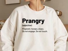 Makes a hilarious and memorable gift for friends, family, or anyone who experiences the rollercoaster of emotions that comes with being "prangry." STEPS TO ORDER 1) Select sweatshirt, hoodie or T-shirt size from the first Drop Down menu.  2) Select your color from the second Drop Down menu. 3) Choose your quantity as much as you want. 4) In "Add Your Personalization" Section, please specify your: "Text color"(Black or White) Please Note * Actual product colors may vary from colors shown on your Rollercoaster Of Emotions, New Mom Shirt, Funny Pregnancy Announcement, Funny Pregnancy, Pregnancy Announcement Shirt, Pregnancy Humor, Mom To Be, New Mom Gift, Pregnancy Reveal