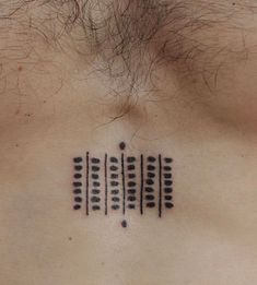 a close up of a person's chest with an electronic device tattoo on it