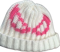 a white and pink knitted hat with the word love on it