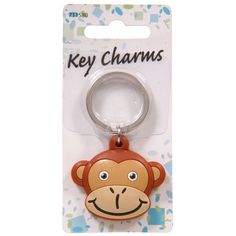 a keychain with a monkey face on it's front and back side