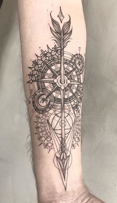 a black and white tattoo design on the arm