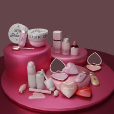 there is a pink cake with makeup and cosmetics on it