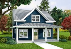 this is a computer rendering of a small blue house