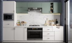 a kitchen with green cabinets and white counter tops