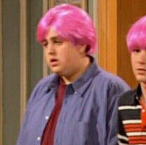 two men with pink hair standing next to each other