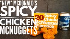 the new mcdonald's spicy chicken nuggets are next to a can of soda