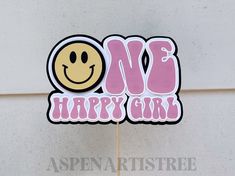 a cake topper with the words no b happy girl written in pink and yellow