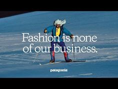 a man riding skis down a snow covered slope with a quote on it that says fashion is the stone of our business