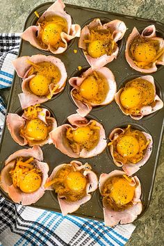 an open muffin tin filled with baked eggs