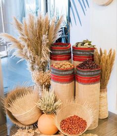 there are many different types of food in the baskets on the table, including beans and rice