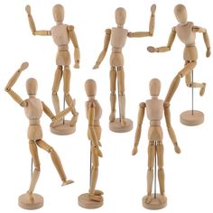 several wooden mannequins are posed in different positions