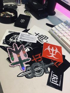 various stickers and decals on a computer desk