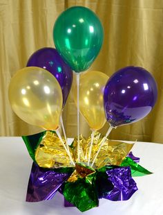 a bunch of balloons that are sitting on a table