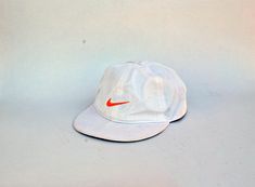 PLEASE NOTE: THE BRIM IS BENDED IN THE MIDDLE WHICH IS KIND OF VISIBLE IF YOU TRY TO BEND IT...  Vintage Hat with SB and swoosh logo in front, the front logos are embroidery. Color is white with orange. adjuster in the back see all images for details Brand : See images Made in China Size : Adults One Size Condition : New Info: Machine Washable suggested Hand Wash Please, read our shop policies before purchasing. Please, contact if you have any more questions. White Snapback Trucker Hat For Streetwear, White Hip Hop Trucker Hat For Outdoor, White Hip Hop Baseball Cap For Outdoor, White Snapback Fitted Hat, White Hip Hop Hat For Streetwear, White Snapback Baseball Cap For Streetwear, White Hip Hop Trucker Hat With Flat Bill, White Hip Hop Snapback Hat For Streetwear, Vintage White Trucker Hat For Outdoor