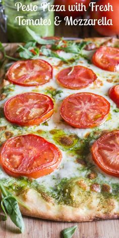 pizza with fresh tomatoes and mozzarella on it