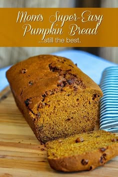 a loaf of pumpkin bread sitting on top of a wooden cutting board