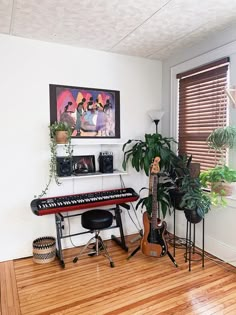 a living room filled with musical instruments and potted plants