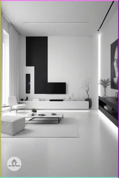 a modern living room with white furniture and black accents