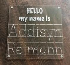 a clear acrylic sign that says, hello my name is adidasyn keronn