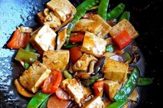 stir fry with vegetables and tofu in a wok