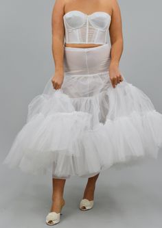 Feel fun and flirty with this tulle tiered petticoat skirt! Give any dress or skirt extra volume with the fluffiness of this skirt. Has a polyester slip underneath so you don't feel any of the scratchiness of the tulle. Intended to fit all sizes can fit up to a 40 inch waist and can be cinched to the size of a branch, self tie closure. Sheer design. Model is a 6'0 with a 32" waist Tulle Petticoat, Petticoat Skirt, Fluffy Skirt, Design Model, Petticoat, Wedding Planning, Couture, Skirt, Hair