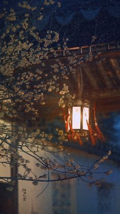 an old fashioned lantern hanging from a tree in front of a building with snow on the ground