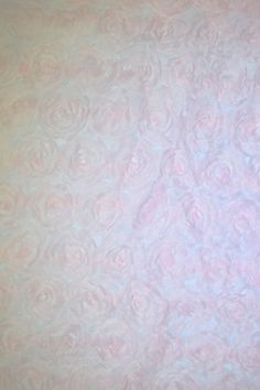 a pink and blue background with swirls on it