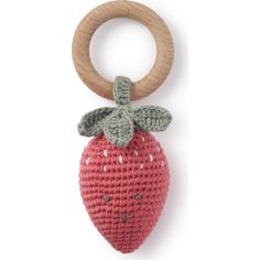 a crocheted strawberry keychain with a wooden ring on it's end