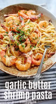 garlic butter shrimp pasta in a bowl with a fork