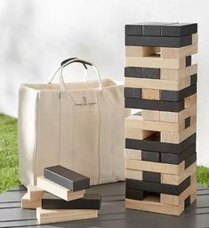 a bag sitting on top of a wooden block tower