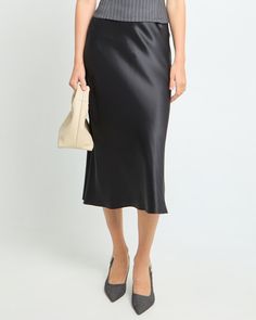 Price Comparison Few Moda $69 Reformation $198 Aritzia $128 Product Details Upgrade your wardrobe with the Alaia Silk Skirt, a luxurious and versatile midi-length piece that will elevate any outfit. With its easy wear design, you'll love how effortlessly chic you'll look and feel. Made with high-quality silk, this skirt offers a gorgeous sheen and comfortable feel. - Elastic waist- Lightweight silk- Crafted with 19mm fabric weight to achieve a luxurious drape and soft touch.- Content: 100% Mulbe Relaxed Black Satin Skirt, Silk Midi Skirt, Black Midi Skirt, Silk Skirt, Price Comparison, Black Xs, Mulberry Silk, Upgrade Your Wardrobe, Effortlessly Chic