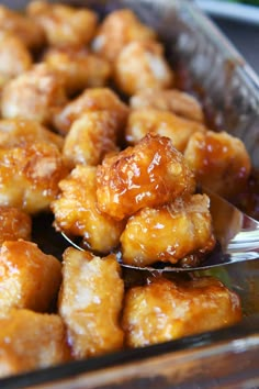 a close up of a spoon with some food on top of it in a pan