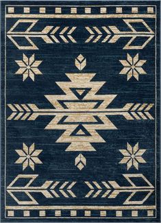 a blue rug with gold and white designs on it, including an arrow design in the middle