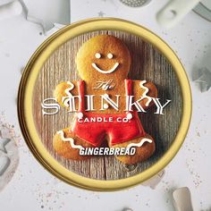 a gingerbread cookie with the words stinky candle co on it's front