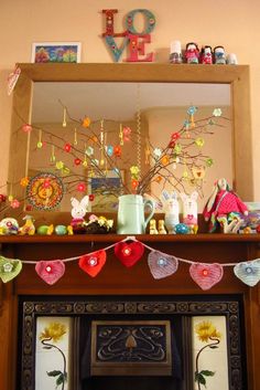 there is a fireplace with decorations on the mantle