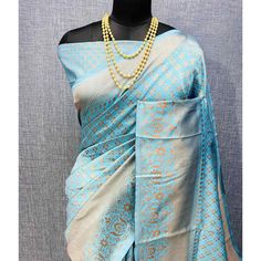 Light Blue colored saree is made from banarasi silk fabric which is highlighted with beautiful weaving work as shown. Comes along with unstitched banarasi silk blouse piece which you can customise as per your design/style. Occasion - You can wear this saree for festivals and functions. Note:- the actual product may differ slightly in color and design from the one illustrated in the images when compared with computer or mobile screen. Measurements: Saree : Banarasi Silk : 5.5 Mtrs Blouse : Banarasi Silk : 0.8 Mtr Material: Banarasi Silk Stitch Type: Unstitched Country of Origin: India Care Guide: Dry Clean Blue Slub Silk Traditional Bollywood Wear, Blue Katan Silk Pre-draped Saree With Zari Work, Blue Jamawar Pre-draped Saree With Zari Weaving, Blue Pre-draped Saree With Zari Weaving, Elegant Light Blue Saree For Festivals, Blue Bollywood Banarasi Silk Pre-draped Saree, Bollywood Style Light Blue Saree With Zari Work, Blue Slub Silk Saree With Zari Weaving, Designer Light Blue Saree With Zari Work