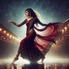 a woman is dancing in the rain with her dress flowing down and lights on behind her