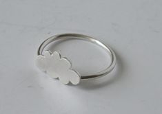 "Cute little Cloud Ring! I handmake each cute little cloud ring. Each cloud is drawn out onto sterling silver and then sawn, shaped and finished by hand. Then each one is soldered to a handmade sterling silver ring, made to your size. The cloud is about 1/2\" or 12mm. The ring is also available with copper, brass or black cloud. Made to Order Please see FAQ below for current processing time and return policy. *PLEASE READ BEOFRE ORDERING* All of the metals (Sterling Silver, Copper, Brass) used i Cloud Jewelry, Silhouette Jewelry, Cloud Ring, Cloud Shape, Minimal Ring, Rain Cloud, Handmade Sterling Silver Rings, Silver Cloud, Cloud Shapes