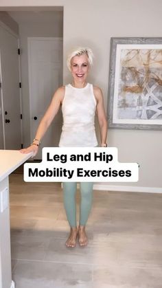 a woman standing in front of a kitchen counter with leg and hip mobility exercises on it