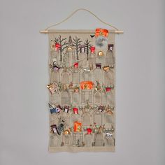 a wall hanging with various items on it