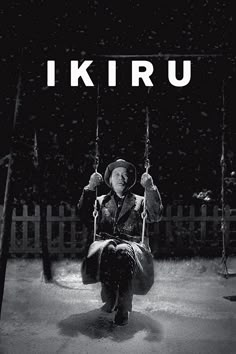 a black and white photo of a man on a swing in the snow with text that reads, i kiru