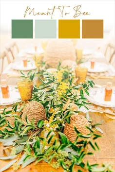 the table is set with pine cones and greenery